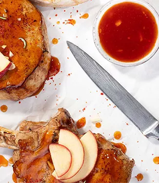 Schweinekotelette in Rum-Apfel-Marinade